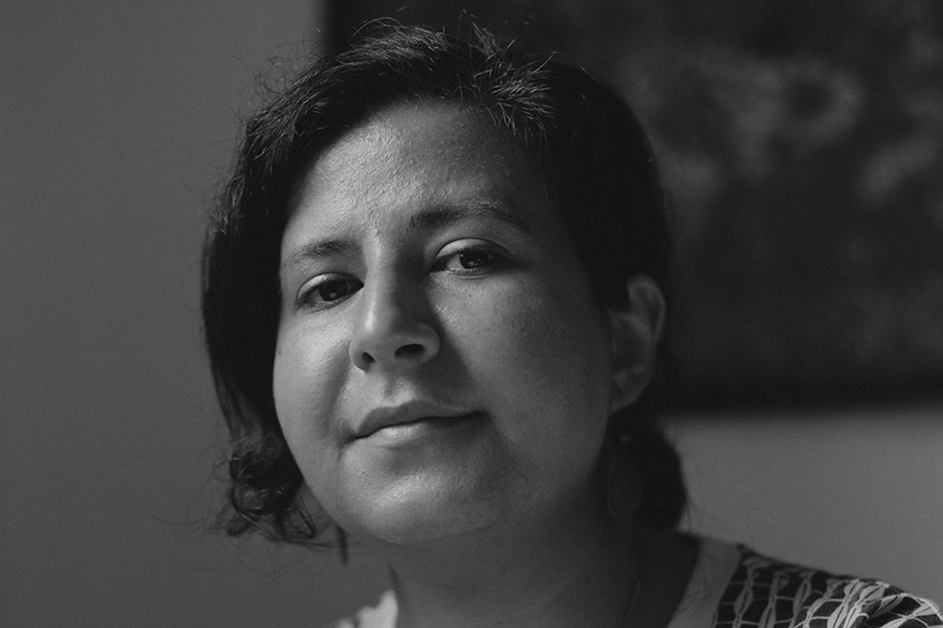 Black and white portrait of poet Marwa Helal